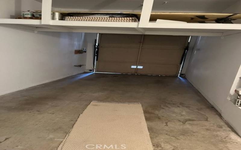 Single car direct access garage plus carport.