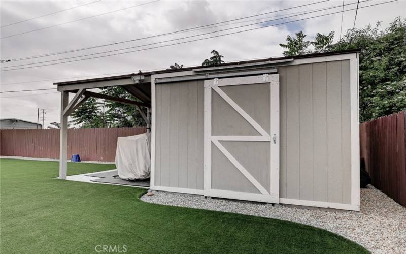 He / She Shed or kids playhouse with double sliding barn doors