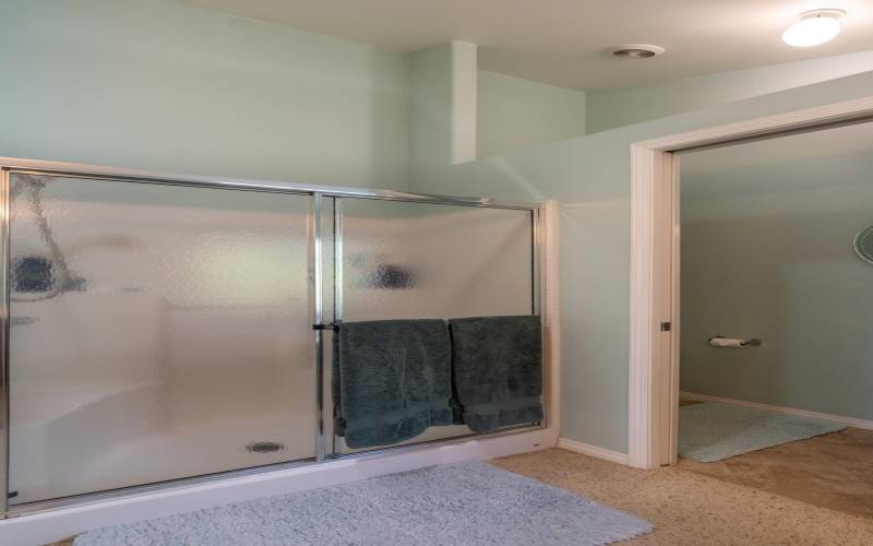 Separate shower in the master bedroom bath. Commode with added door for privacy.