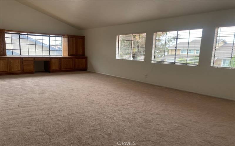 Upstairs has a Giant Bonus Room with built-in  storage and work desk.