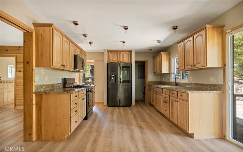 This is a large kitchen and even has a pantry.