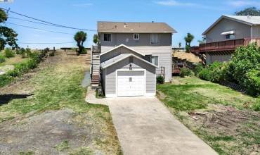 Shows front of house & Detached Garage