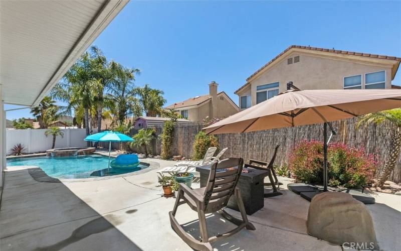 Side Patio Cover outlooks the salt water pool. Fire pit with cover. Umbrellas come with the home