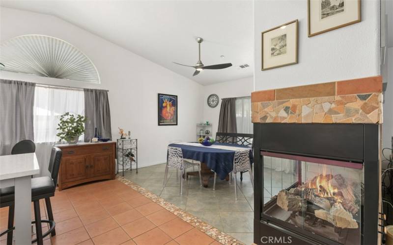 Spacious Great Room flows to upgraded kitchen with dual fireplace