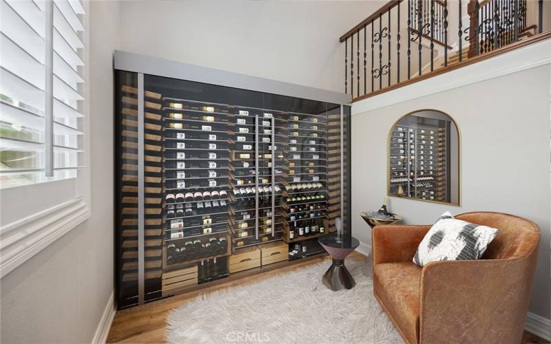 Wine Refrigerator under Back Stair Case - Virtually Staged
