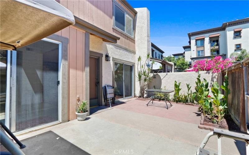 good sized fenced in private patio area with plants