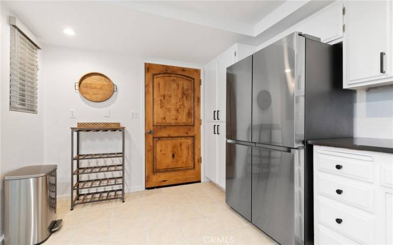 Access to the garage makes unloading groceries easier. Refrigerator stays!