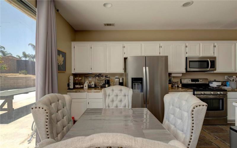 The breakfast nook at the kitchen area with a peek of the backyard.