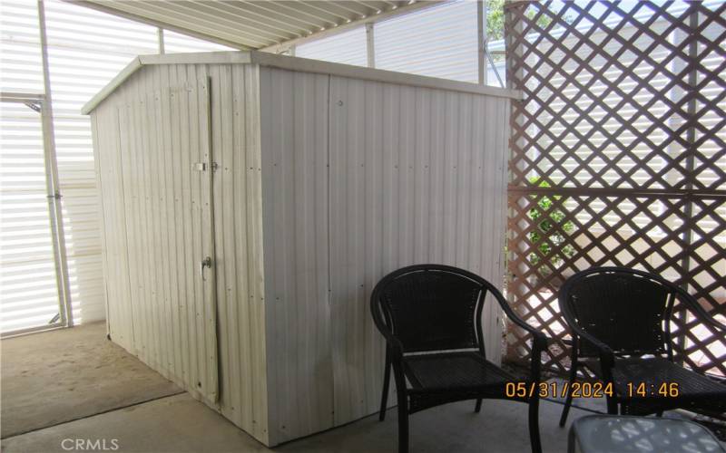 Storage Shed at end of Car Port, entry to rear yard.
