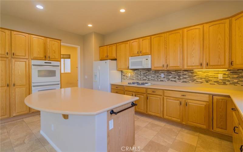 Laundry with pantry and deep sink.