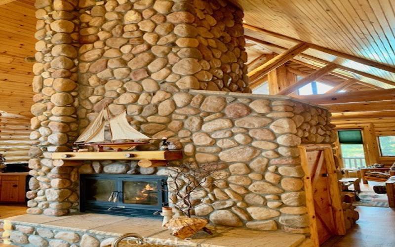 Massive rock fireplace that can heat up the entire living room & dining area...