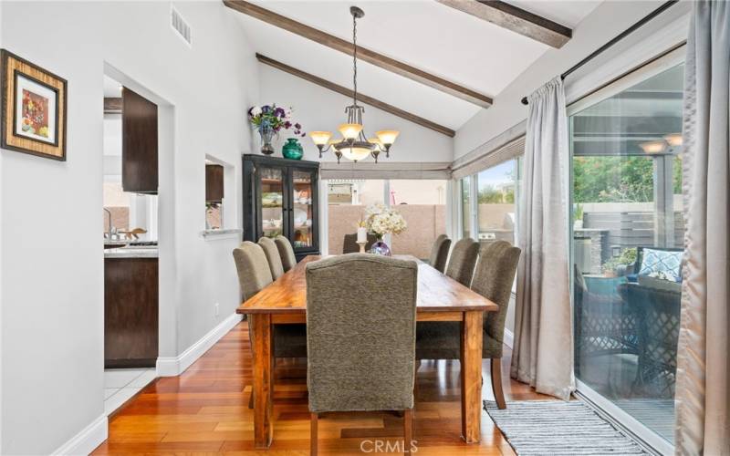 The dining room also has accented beams, adding to the custom and elegant design of the home.