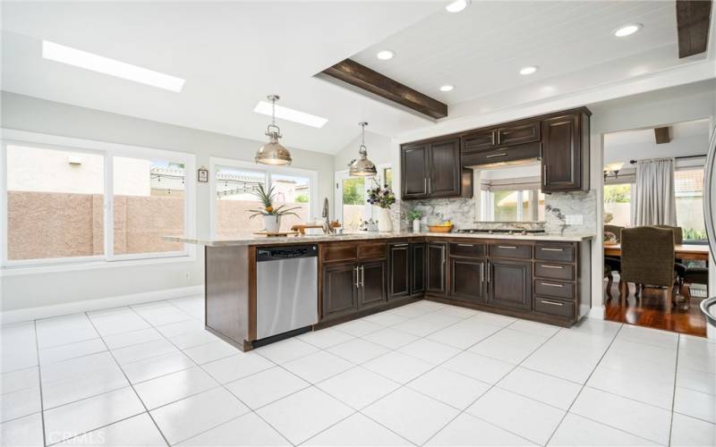 Enjoy Stainless Steel Appliances, a Built-in Dacor Gas Cooktop, White Oak Cabinetry and Granite Countertops in the Kitchen!