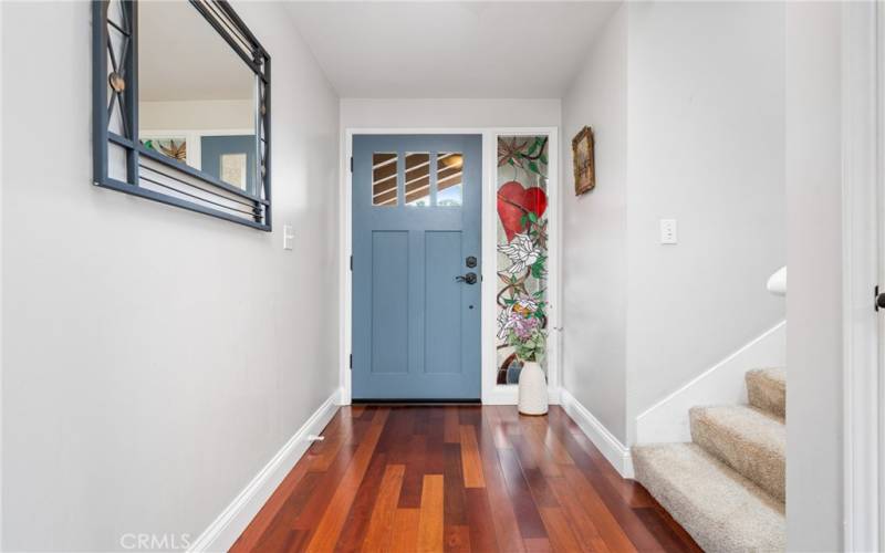 Entering the home, you are greeted by Brazilian wood floors that expand throughout parts of the downstairs of the home!