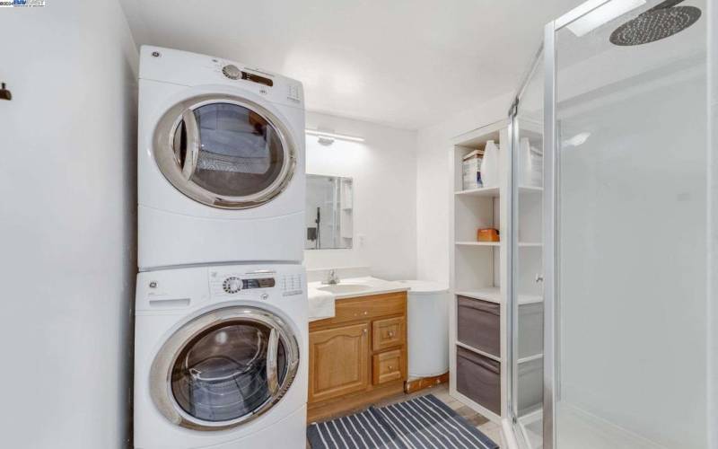 Shower with Laundry setup in the back unit.