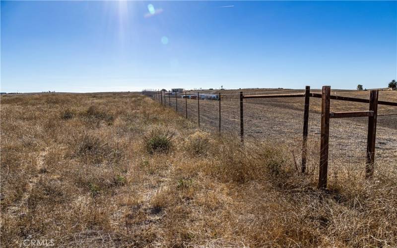 View Looking South from NW Corner of Property (property on left side of fence)