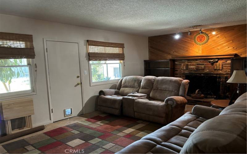 Living Room with brick fireplace