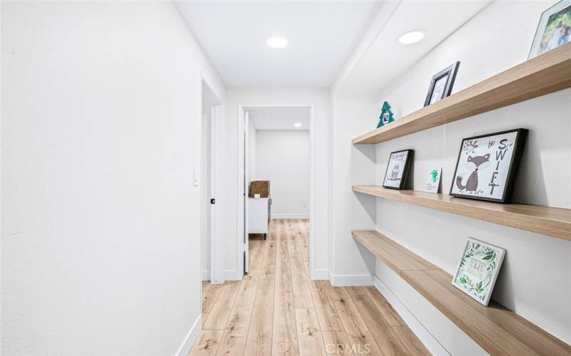 Hallway alcove with shelves