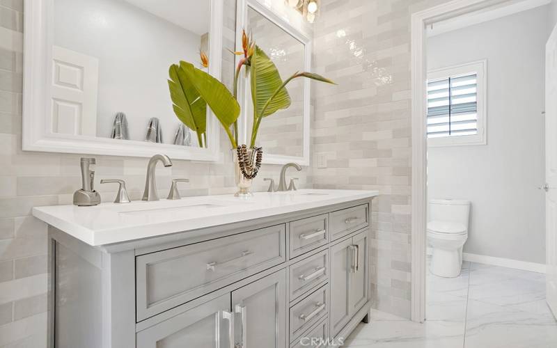 Guest Bathroom upstairs beautifully remodeled with modern features, separate toilet room, and large walk-in shower.