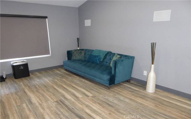 Master Bedroom seating for TV or Reading area. Real Wood Flooring in Master & other bedrooms.