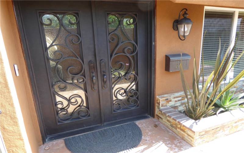 Front Door with Custom Sculptured Wrought Iron & Glass Double Doors