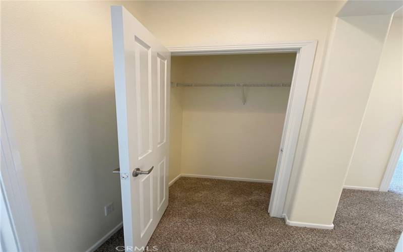 Hall closet by 2nd/3rd bedrooms