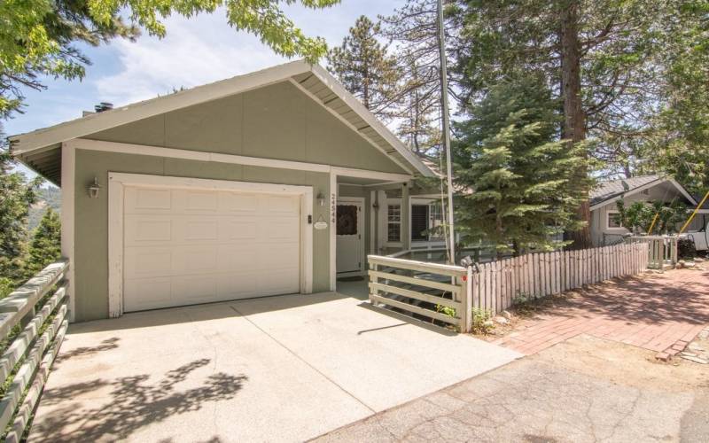 Extra Wide Single car garage at street level w/direct access into home. Driveway and parking on street, extra wide