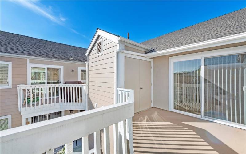Large deck with access from primary bedroom and kitchen area. Laundry closet on deck.