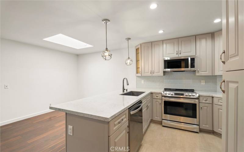 Dining area w/​​‌​​​​‌​​‌‌​​‌​​​‌‌​​​‌​​‌‌​​‌‌​​‌‌​​​​ skylight