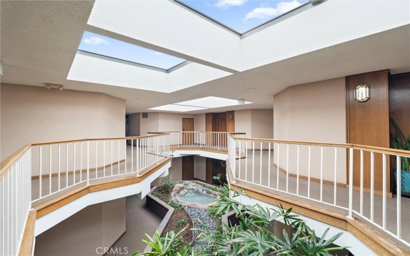 Atrium with living plants and water feature