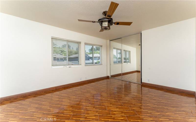 Very large upstairs front bedroom. Ideal for 2 beds :-)  Bamboo looking tile floors.