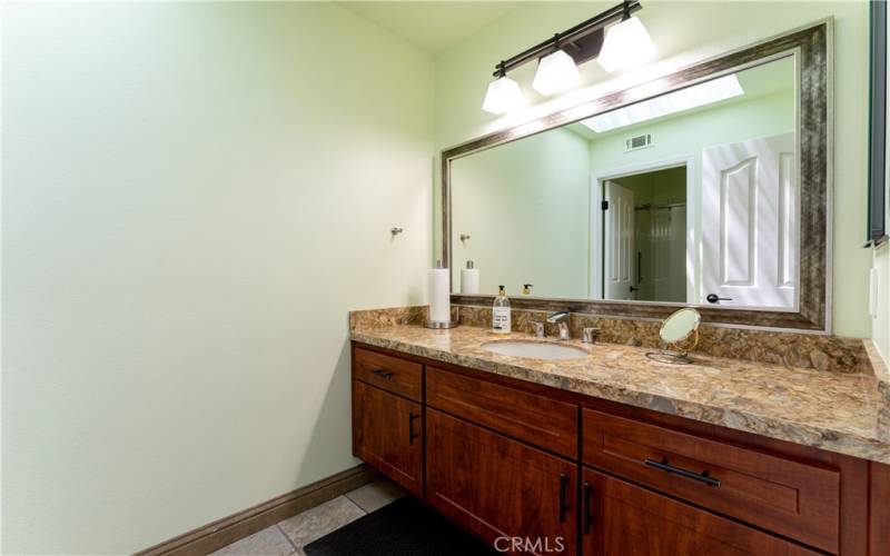 Great replaced vanity and counter top in this really spacious upstairs secondary bathroom. The toilet and bathtub/shower are in a separate room with door. (See floor plan)