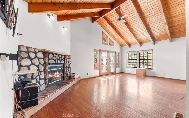 Fireplace with hearth and vaulted wood beam ceilings!