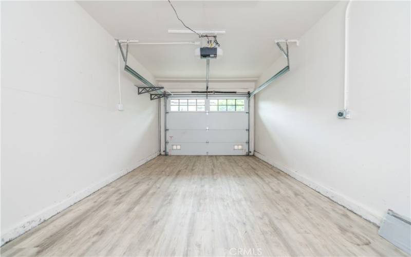 Garage with new flooring and electric charge