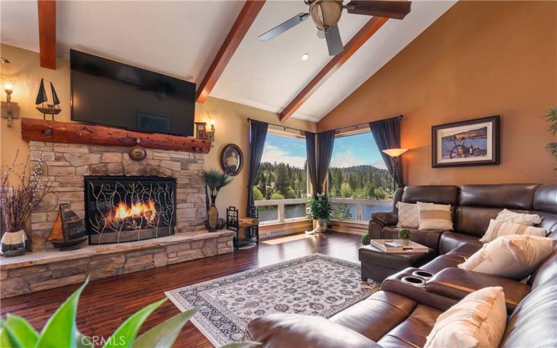 Living Room with wood burning fireplace & lake views from 6ft windows.