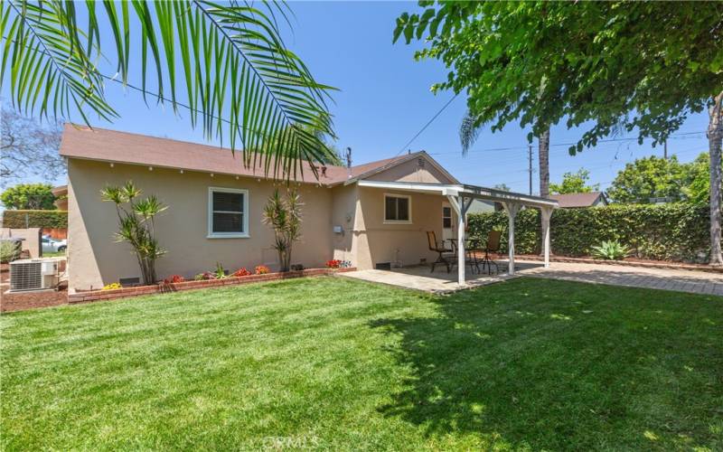 Spacious back yard with covered patio