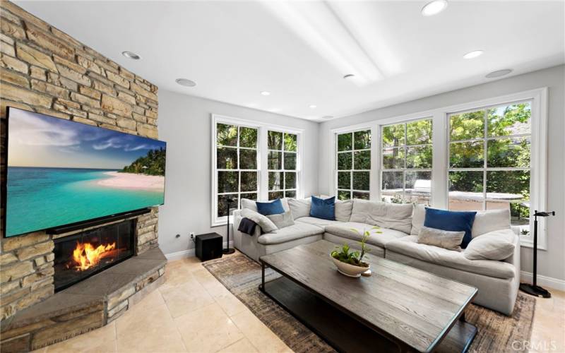 Family room off of the kitchen with plenty of natural light.