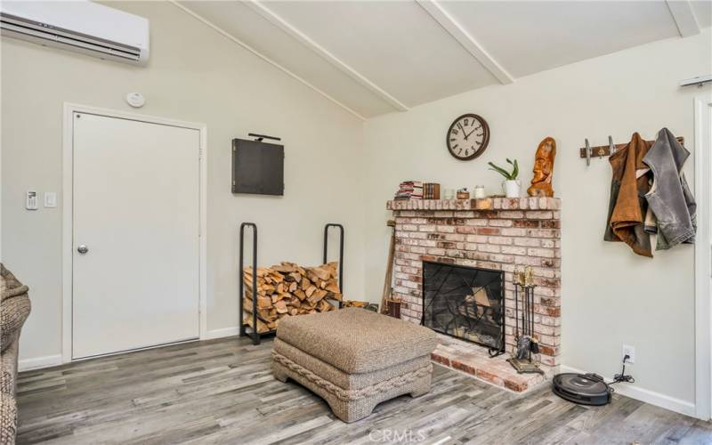 Cozy fireplace and door to attached garage