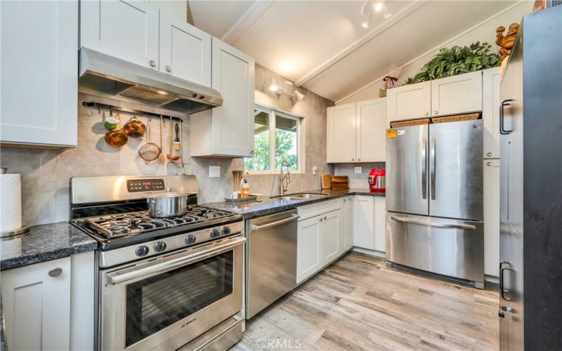 Stainless appliances with recently replaced cabinetry and countertops.