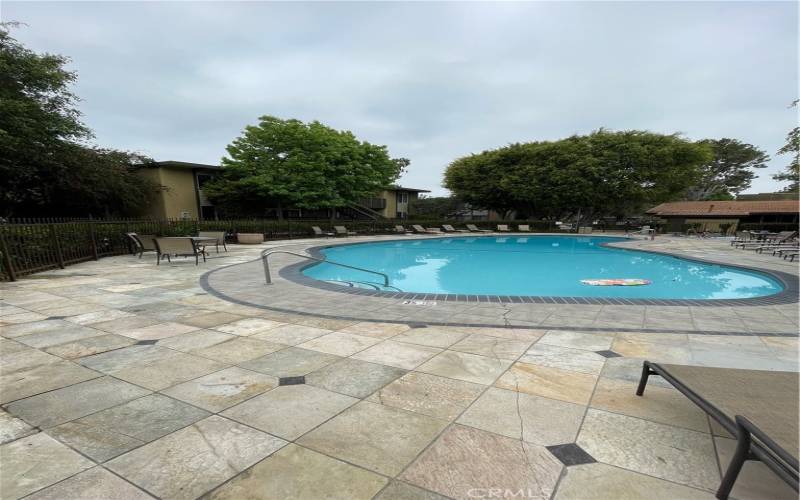 Lots of lounge chairs to relax and enjoy the beautiful pool area