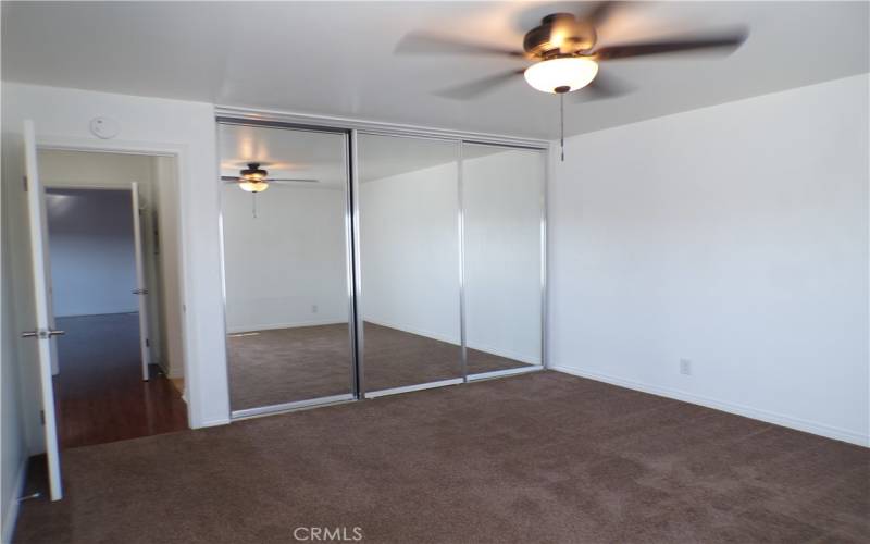 Floor to ceiling triple sliding closet doors