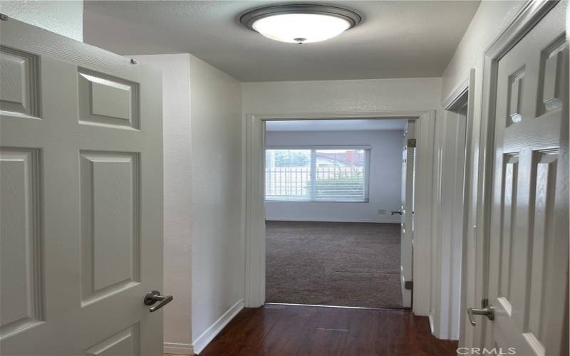 Hallway with storage closet on the right