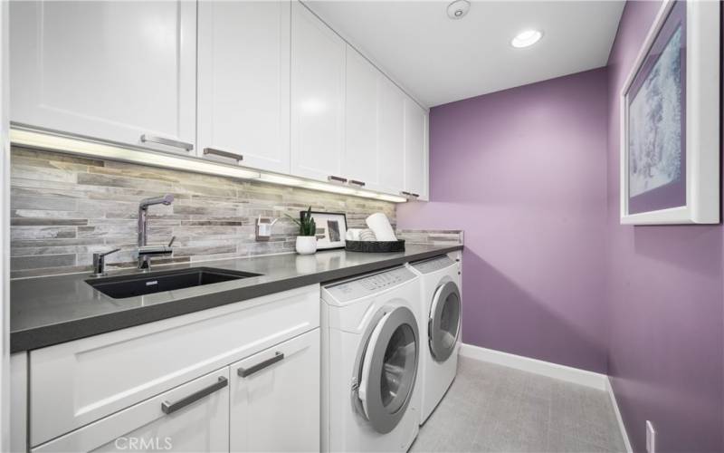 Laundry Room, Quartz Counter, Porcelain Tile Floor & Miele Washer and Dryer to stay with house
