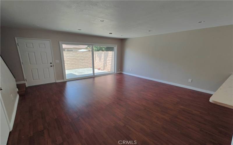 SPACIOUS LIVING ROOM WITH NEW FLOORING