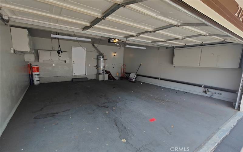 SPACIOUS GARAGE SPACE WITH STORAGE CABINETS