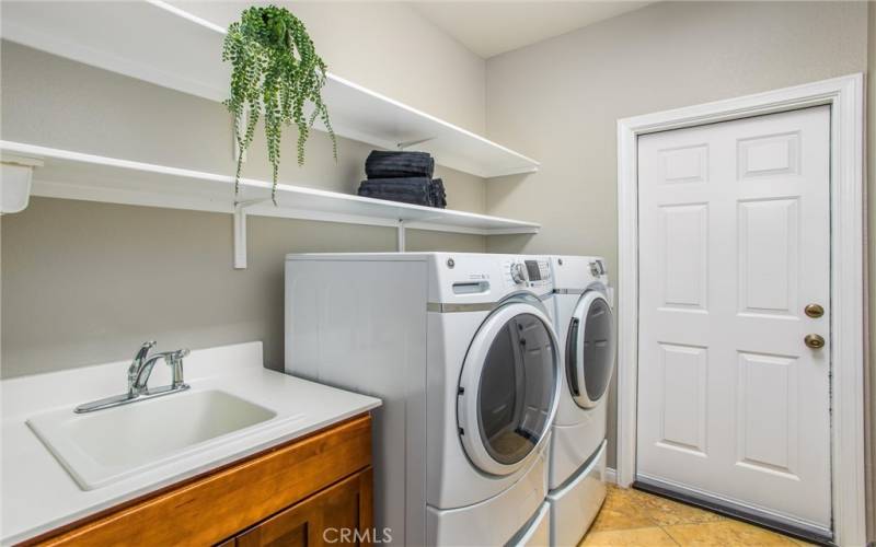 Laundry room with sink and garage access