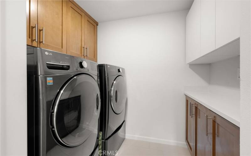 Full size laundry room with added storage.