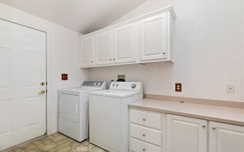 Laundry Room with plenty of Cabinets and a Pantry which isn't shown.