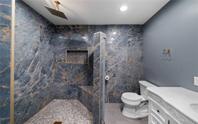 guest bathroom with custom walk in tiled shower