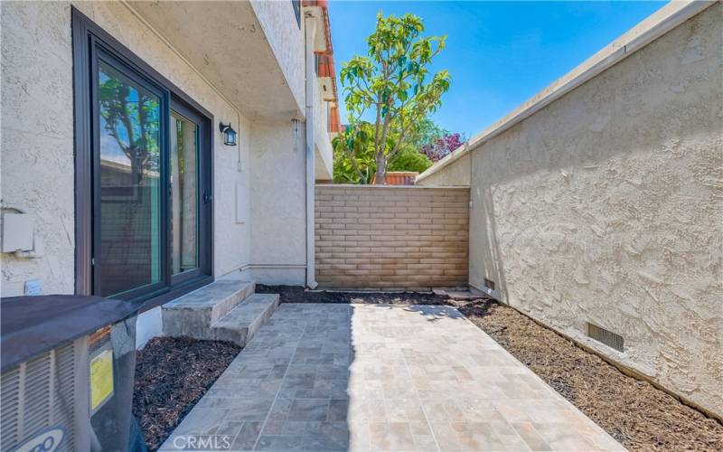 Private patio with gas BBQ hookup. Access to 2 car garage. AC unit.